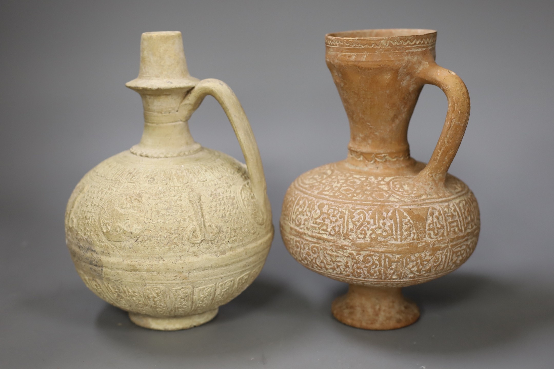 Four Islamic terracotta jugs, Middle Eastern possibly, 12th century, tallest 26cm
